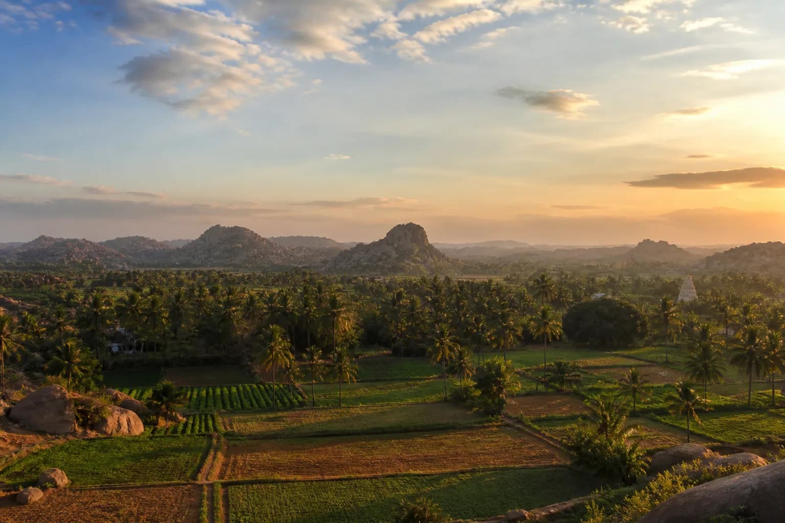 A wide Karnataka landscape at golden hour